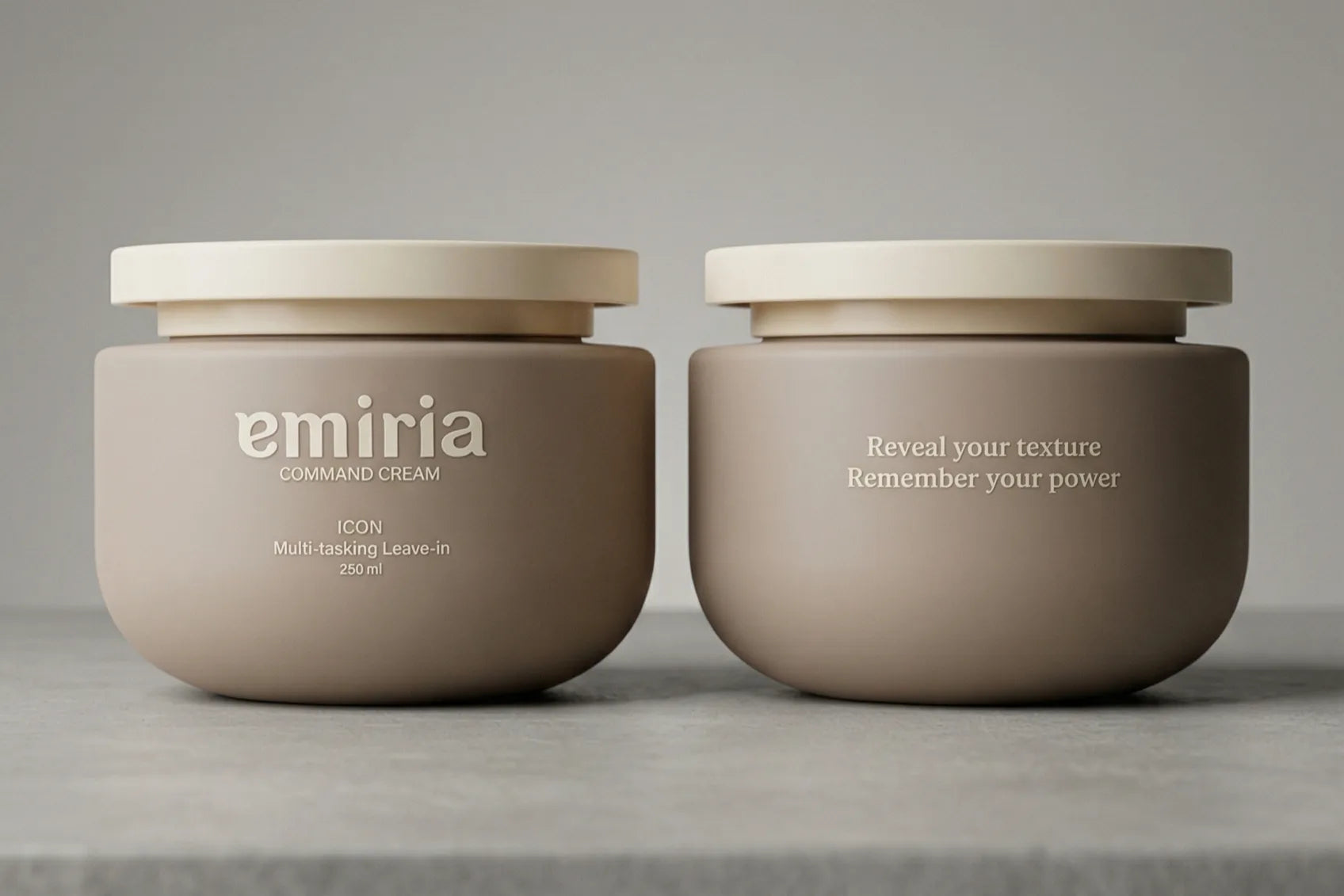 Two beige jars with white lids on a gray surface
