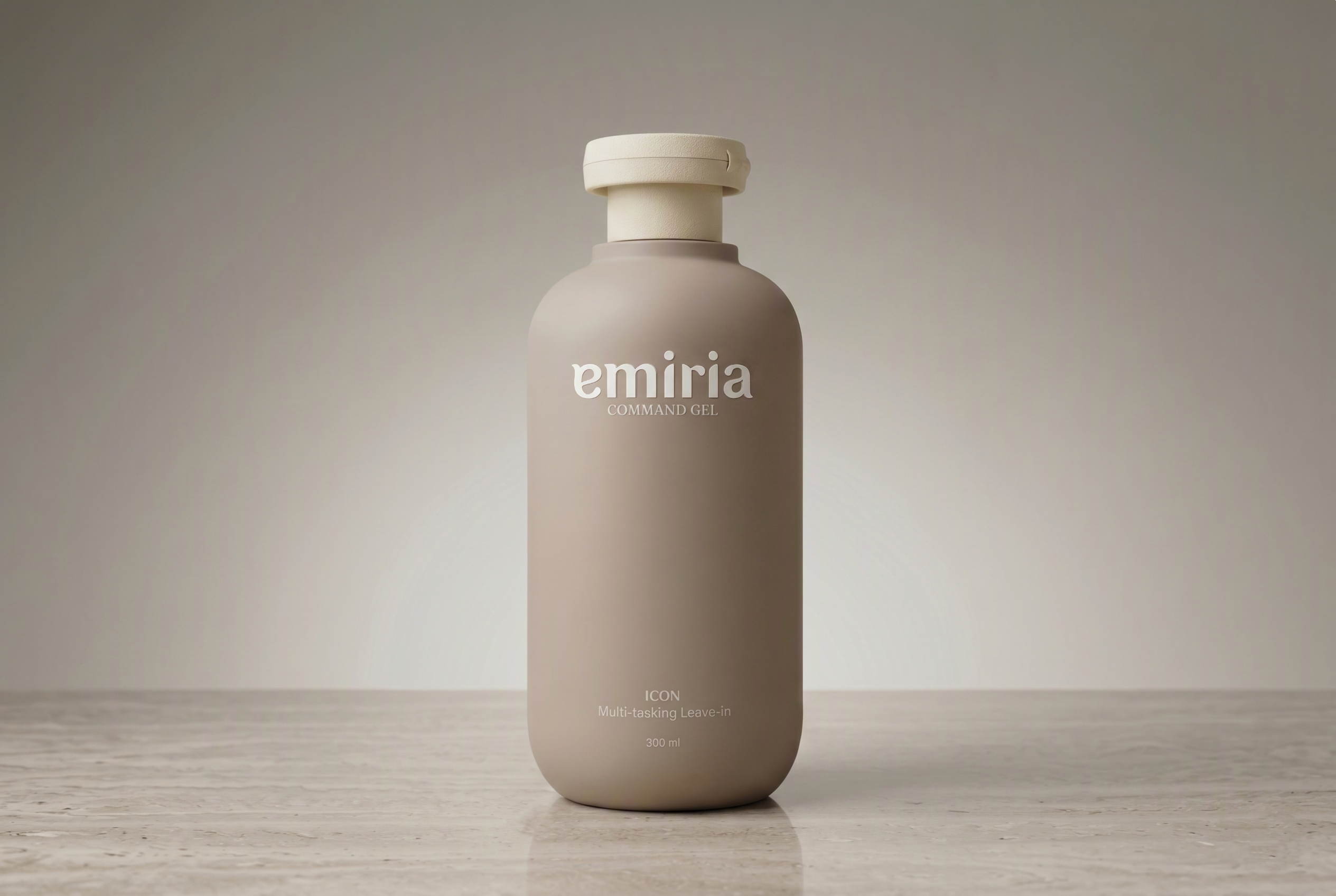 Beige bottle with 'emiria' branding on a wooden surface and beige background